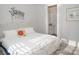 Cozy bedroom with a comfortable white bed frame, floral accents, and bright natural lighting at 5332 Pembrey Dr, Denver, NC 28037