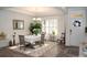 Bright and stylish dining room with a white tablecloth and a window with custom shutters at 5332 Pembrey Dr, Denver, NC 28037