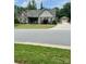 Charming single-Gathering home with stone accents, a manicured lawn, and a detached two-car garage at 5332 Pembrey Dr, Denver, NC 28037