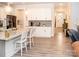 Bright kitchen with white cabinetry, granite countertops, and an island with bar seating at 5332 Pembrey Dr, Denver, NC 28037