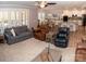 Bright and open living area with hardwood floors, comfortable seating, and natural light at 5332 Pembrey Dr, Denver, NC 28037