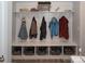 Mudroom featuring a built-in bench with coat hooks and storage baskets at 5332 Pembrey Dr, Denver, NC 28037