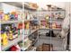 Organized pantry with metal shelving stocked with groceries, jars, and household items at 5332 Pembrey Dr, Denver, NC 28037