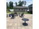 Spacious patio with a fire pit and seating area, perfect for entertaining at 5332 Pembrey Dr, Denver, NC 28037