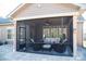 Cozy screened porch features a ceiling fan, comfortable seating, and a view of the backyard at 5332 Pembrey Dr, Denver, NC 28037