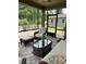 Relaxing screened porch with comfortable seating and a view of the landscaped backyard at 5332 Pembrey Dr, Denver, NC 28037