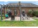 Outdoor patio featuring pergola, seating, grill, and swing at 5379 Roberta Meadows Ct, Concord, NC 28027