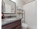 Updated bathroom with granite countertop, dark wood cabinets, and shower and tub combination at 5379 Roberta Meadows Ct, Concord, NC 28027