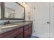 Bathroom with granite countertops, a sink, and ample cabinet space at 5379 Roberta Meadows Ct, Concord, NC 28027