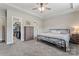 Spacious main bedroom with tray ceiling, carpet floors, and a walk-in closet at 5379 Roberta Meadows Ct, Concord, NC 28027