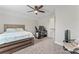 Inviting bedroom with neutral walls, ceiling fan, and a comfy bed, ideal for rest and rejuvenation at 5379 Roberta Meadows Ct, Concord, NC 28027