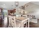 Open-concept dining area featuring hardwood floors and seamless flow to the kitchen and living room at 5379 Roberta Meadows Ct, Concord, NC 28027