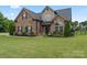 Charming brick home with manicured lawn and mature landscaping, situated on a desirable lot at 5379 Roberta Meadows Ct, Concord, NC 28027