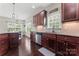 Gourmet kitchen with ample cabinetry, stainless steel appliances, and granite countertops at 5379 Roberta Meadows Ct, Concord, NC 28027