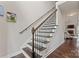 Staircase features a dark wood handrail at 5379 Roberta Meadows Ct, Concord, NC 28027