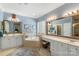 Bathroom featuring double sinks, a bathtub, and ample counter space at 6006 Casswell Cir, Matthews, NC 28104