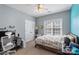Neutral bedroom with plenty of space, natural light and a ceiling fan for added comfort at 6006 Casswell Cir, Matthews, NC 28104