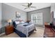 Bright bedroom featuring natural light and a classic design with a desk and bedside table at 6006 Casswell Cir, Matthews, NC 28104