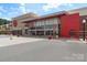 Commercial building showcasing a modern facade with ample parking, clear signage, and inviting entrance at 6006 Casswell Cir, Matthews, NC 28104