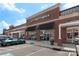 Commercial building featuring a red brick facade with a glass storefront and ample parking at 6006 Casswell Cir, Matthews, NC 28104