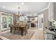 Large open layout combining kitchen, dining area, and views to a patio, perfect for entertaining at 6006 Casswell Cir, Matthews, NC 28104