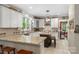Spacious kitchen with white cabinets, granite countertops, a center island, and modern appliances at 6006 Casswell Cir, Matthews, NC 28104