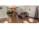 Elegant living room featuring dark wood floors and an adjacent dining area at 6006 Casswell Cir, Matthews, NC 28104