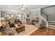 Spacious living room with a view of the open-concept dining and kitchen, great for entertaining at 6006 Casswell Cir, Matthews, NC 28104
