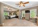 Expansive main bedroom includes a seating area, desk, and balcony access, perfect for relaxation and productivity at 6006 Casswell Cir, Matthews, NC 28104