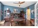 Stylish office with dark wood floors, ample shelving, and a comfortable workspace at 6006 Casswell Cir, Matthews, NC 28104