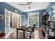 Bright office with a large window and French doors leading to the entryway, enhancing natural light at 6006 Casswell Cir, Matthews, NC 28104