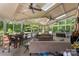 Bright screened-in porch features skylights, ceiling fans and plush furniture with a pool view at 6006 Casswell Cir, Matthews, NC 28104