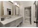 Elegant bathroom with double vanity, marble floors, and modern fixtures at 6242 Creola Rd, Charlotte, NC 28270
