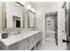 Elegant bathroom featuring double vanity with marble countertop, modern fixtures, and a walk-in shower at 6242 Creola Rd, Charlotte, NC 28270
