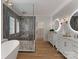 Contemporary bathroom with dual vanities, glass-enclosed shower, and modern lighting at 6242 Creola Rd, Charlotte, NC 28270
