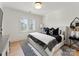Cozy bedroom features a comfortable bed, stylish black and white decor, and bright natural light at 6242 Creola Rd, Charlotte, NC 28270