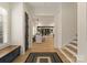 Inviting foyer with hardwood floors, leading to an open-concept dining and living area with lots of natural light at 6242 Creola Rd, Charlotte, NC 28270
