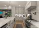 Bright and airy kitchen with stainless steel appliances, a large island, and hardwood floors at 6242 Creola Rd, Charlotte, NC 28270
