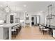 Open concept with a kitchen island that offers barstool seating and pendant lighting above the countertops at 6242 Creola Rd, Charlotte, NC 28270