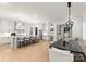 Bright kitchen with marble countertops, stainless steel appliances, and a large island with seating at 6242 Creola Rd, Charlotte, NC 28270