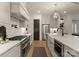 Well-equipped kitchen featuring modern appliances, marble countertops, and a stylish range hood at 6242 Creola Rd, Charlotte, NC 28270