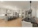 Spacious kitchen featuring stainless steel appliances, barstool seating, and an open layout connecting to the dining area at 6242 Creola Rd, Charlotte, NC 28270