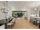 Open-concept living and dining area with hardwood floors and modern finishes, seamlessly connecting to the kitchen at 6242 Creola Rd, Charlotte, NC 28270