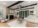 Comfortable living room with a fireplace, stylish décor, and access to outdoor space at 6242 Creola Rd, Charlotte, NC 28270