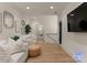 Cozy living room with neutral tones, hardwood floors, and ample seating at 6242 Creola Rd, Charlotte, NC 28270