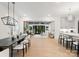 Open-concept living space featuring a dining area, living room, and kitchen with hardwood floors at 6242 Creola Rd, Charlotte, NC 28270
