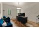 Modern office with custom wall design, sleek desk, contemporary lighting, and plush blue chairs at 6242 Creola Rd, Charlotte, NC 28270
