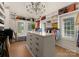 Spacious walk-in closet with custom shelving, an island, and natural light at 6242 Creola Rd, Charlotte, NC 28270