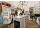 Organized walk-in closet with a central island, ample storage, and a beverage fridge at 6242 Creola Rd, Charlotte, NC 28270