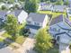 Charming two-story home with a well-maintained yard, showcasing its curb appeal and neighborhood setting at 6945 Agava Ln, Charlotte, NC 28215
